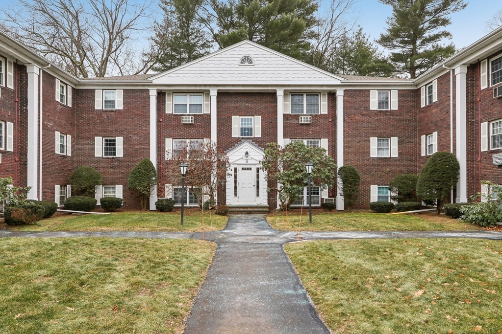 3 Drummer Road, Unit B3 Acton, MA 01720 - Photo 13 of 16 a front view of a house with a yard