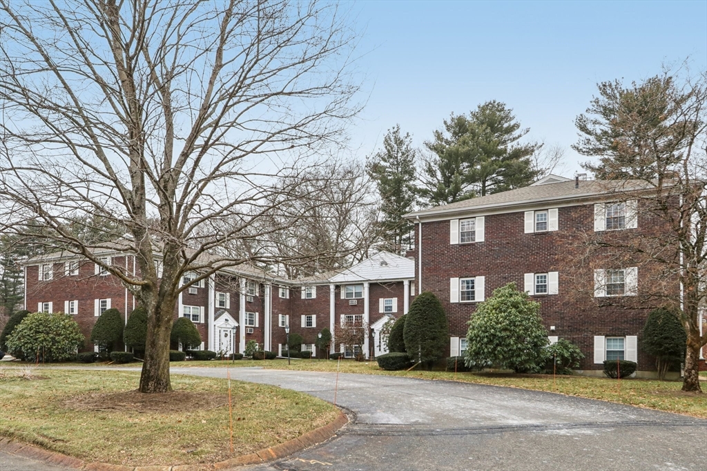 3 Drummer Road, Unit B3 Acton, MA 01720 - Photo 15 of 16 a front view of residential houses with yard and trees