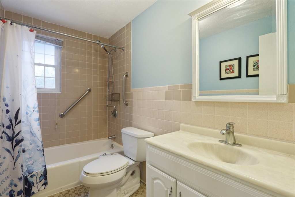 3 Drummer Road, Unit B3 Acton, MA 01720 - Photo 9 of 16 a bathroom with a sink toilet and shower