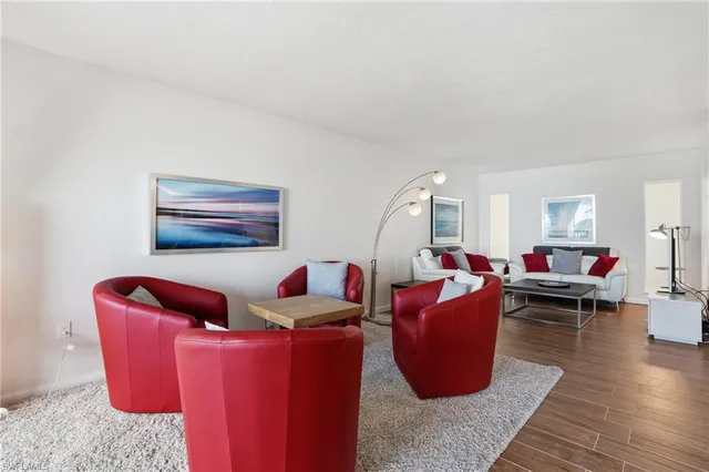 a kitchen with stainless steel appliances a microwave a sink and cabinets