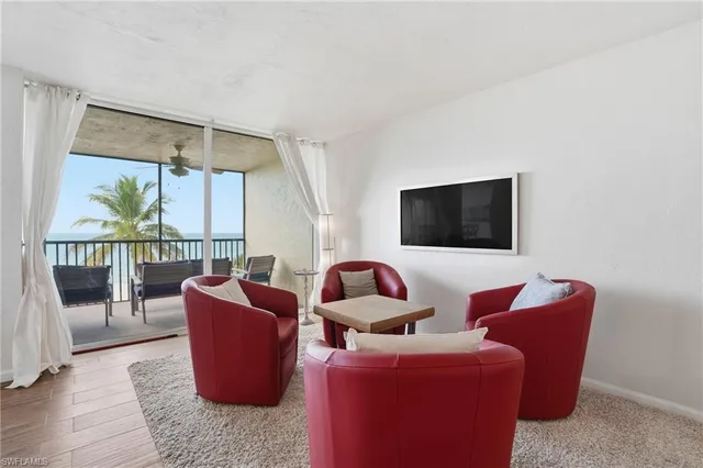 a kitchen with refrigerator and cabinets