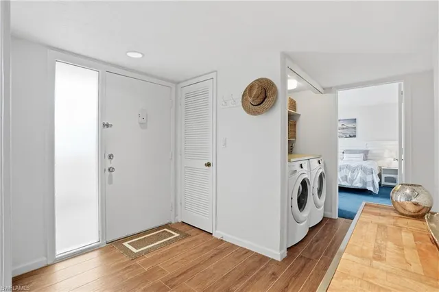 a living room with furniture a rug and a window