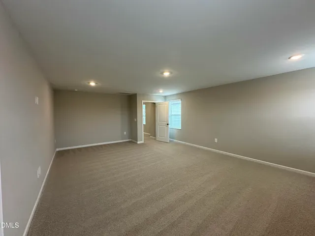 a bathroom with a tub shower and sink
