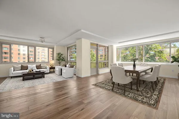 a view of a dining room with furniture and wooden floor