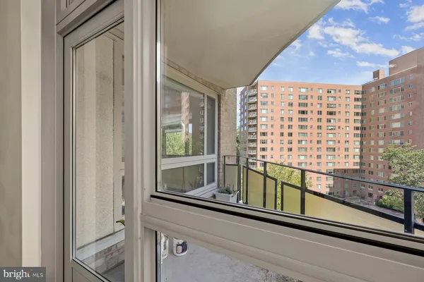 a kitchen with granite countertop white cabinets and stainless steel appliances