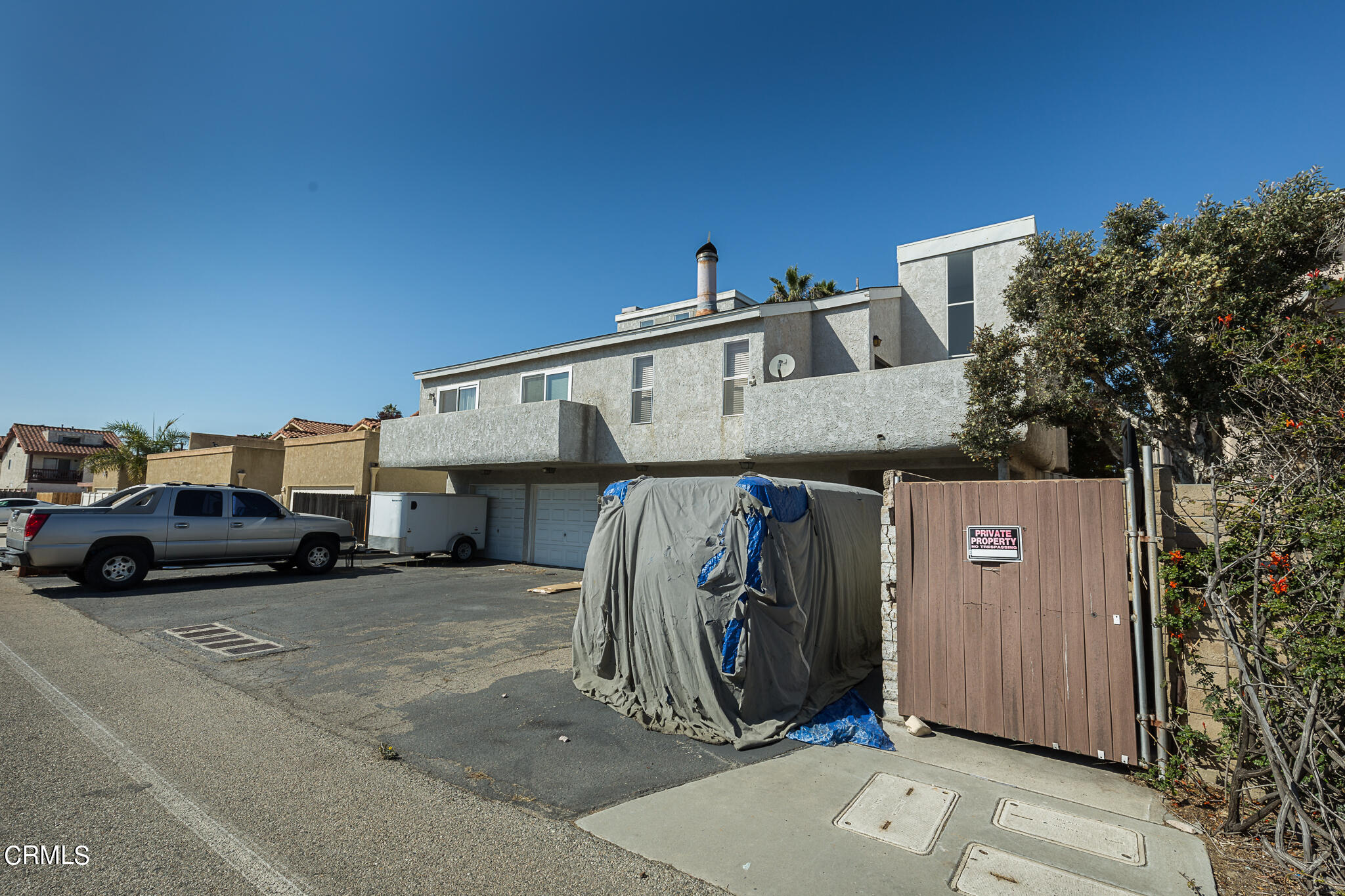 5036 West Wooley Road Oxnard, CA 93035 - Photo 2 of 21 a view of a car park in front of house
