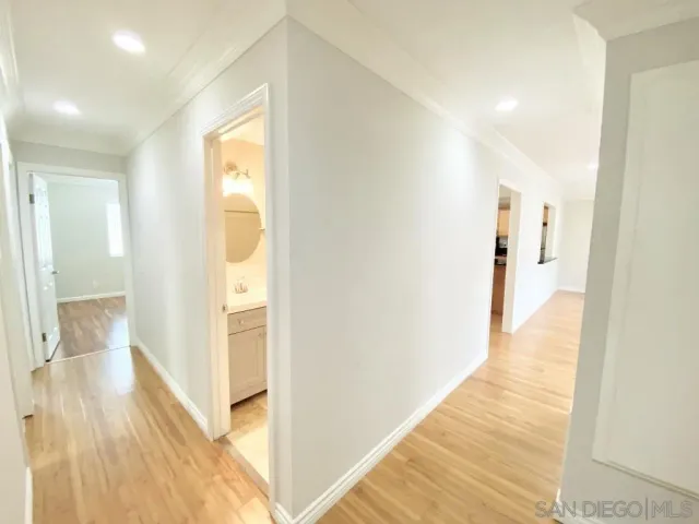 a view of an entryway with a table and chair