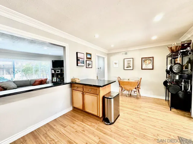 a kitchen with granite countertop a stove and a refrigerator