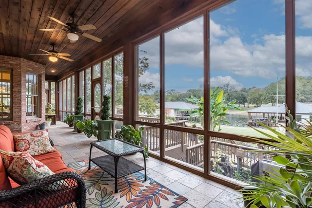 a view of a dining room with furniture wooden floor and outside view