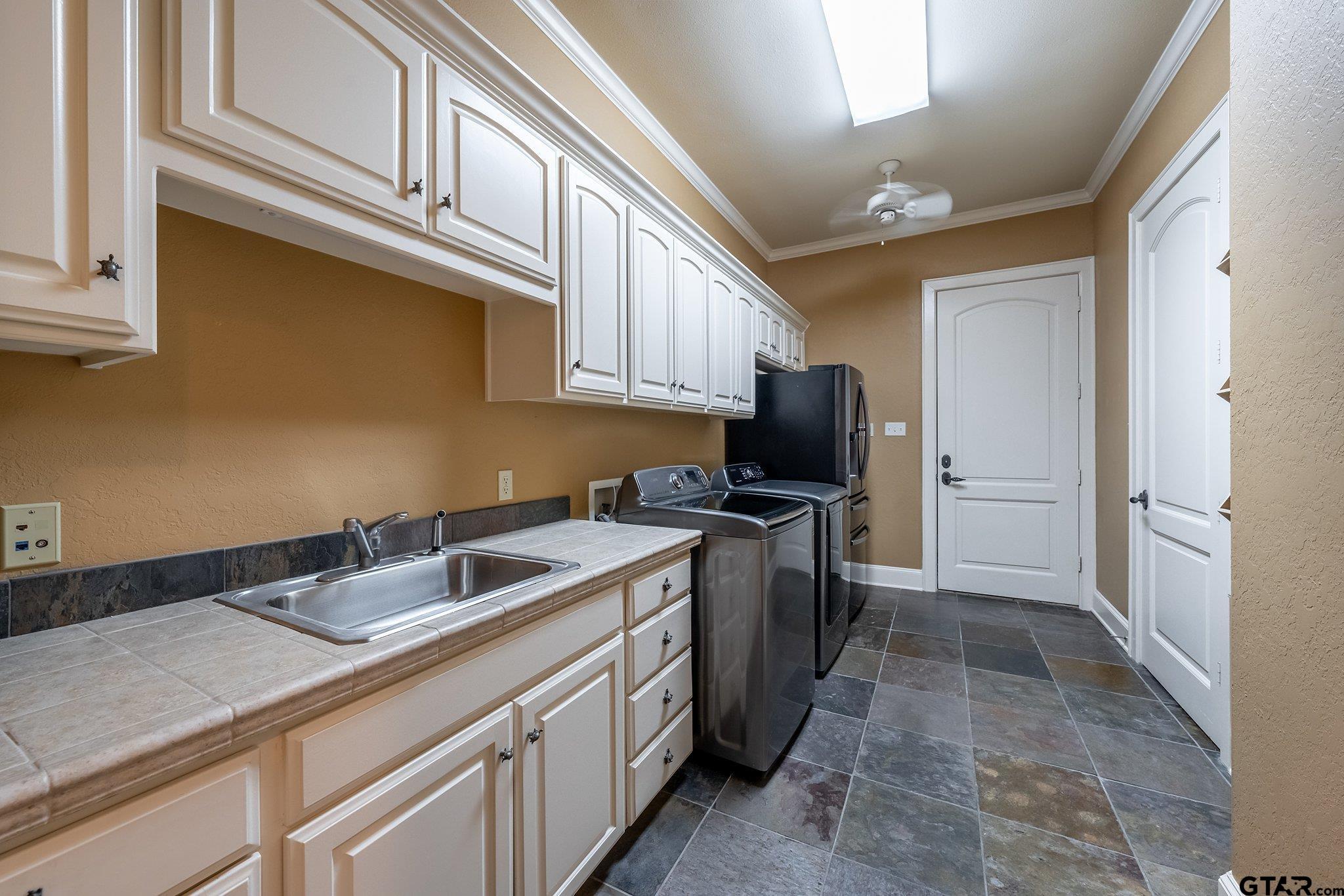 17654 Southpoint Road Whitehouse, TX 75791 - Photo 21 of 47 a kitchen with stainless steel appliances granite countertop a sink stove and cabinets