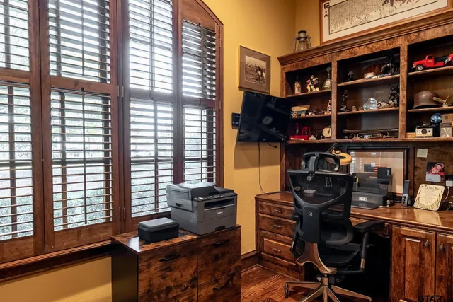 a room with furniture projector and screen