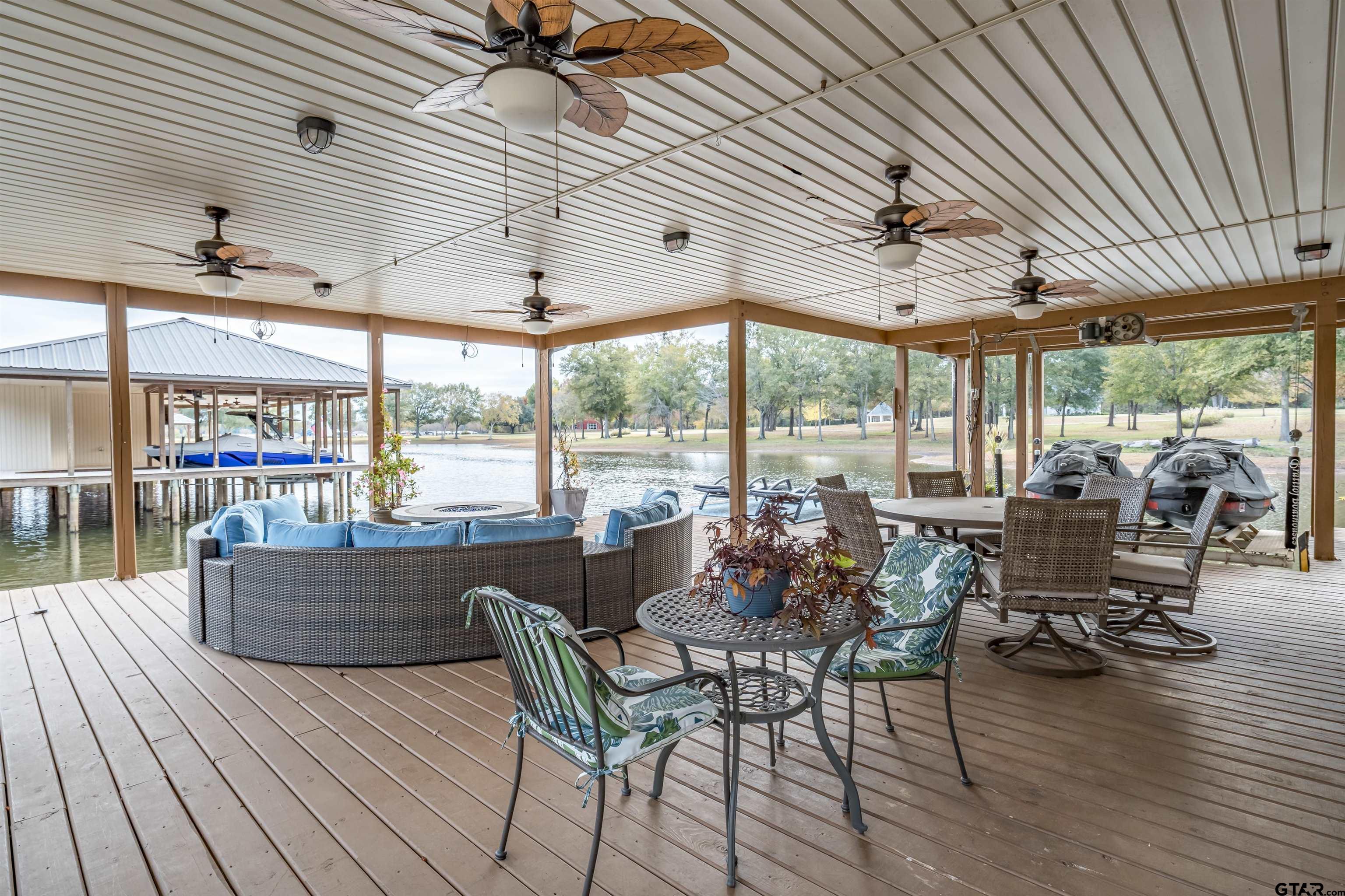 17654 Southpoint Road Whitehouse, TX 75791 - Photo 40 of 47 a view of a dining room with furniture wooden floor and outside view