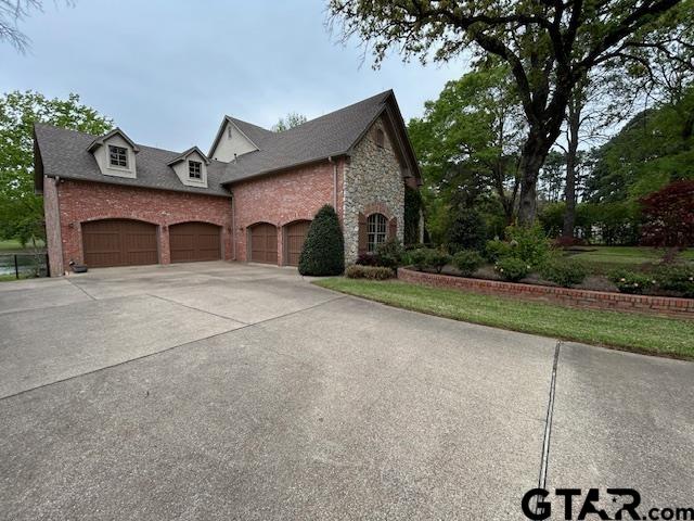 17654 Southpoint Road Whitehouse, TX 75791 - Photo 5 of 47 a view of a house with a yard and garage