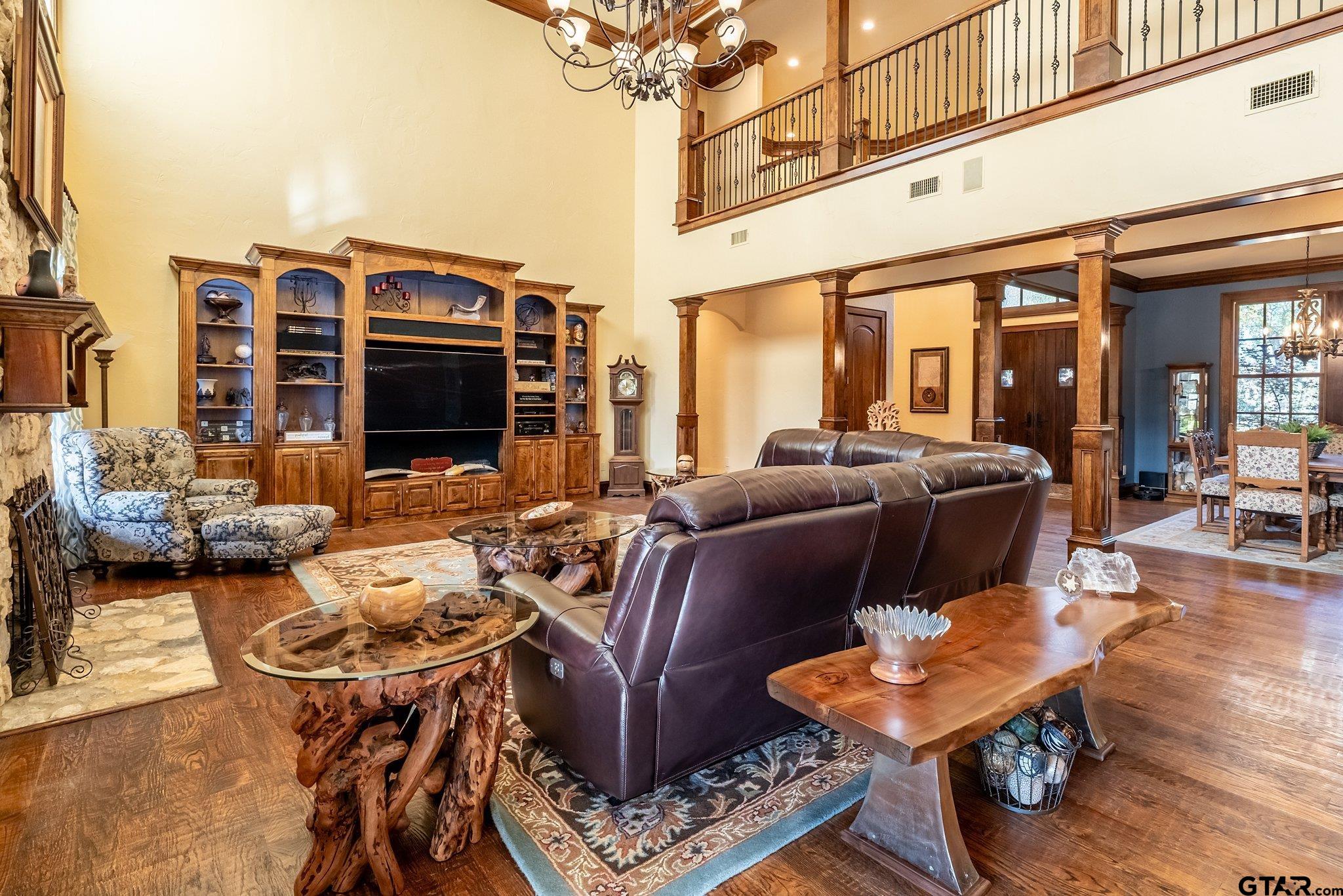 17654 Southpoint Road Whitehouse, TX 75791 - Photo 9 of 47 a living room with furniture a flat screen tv and a floor to ceiling window
