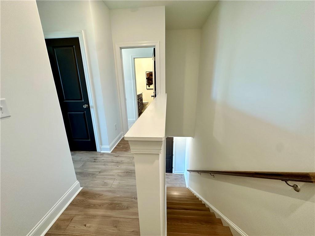502 Alice Way, Unit D21 Cumming, GA 30040 - Photo 13 of 52 a view of a hallway view with staircase