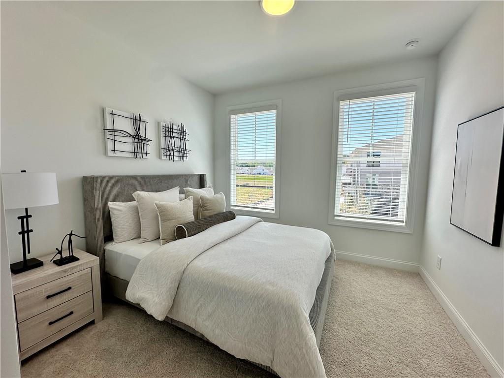 502 Alice Way, Unit D21 Cumming, GA 30040 - Photo 19 of 52 a bedroom with bed and window