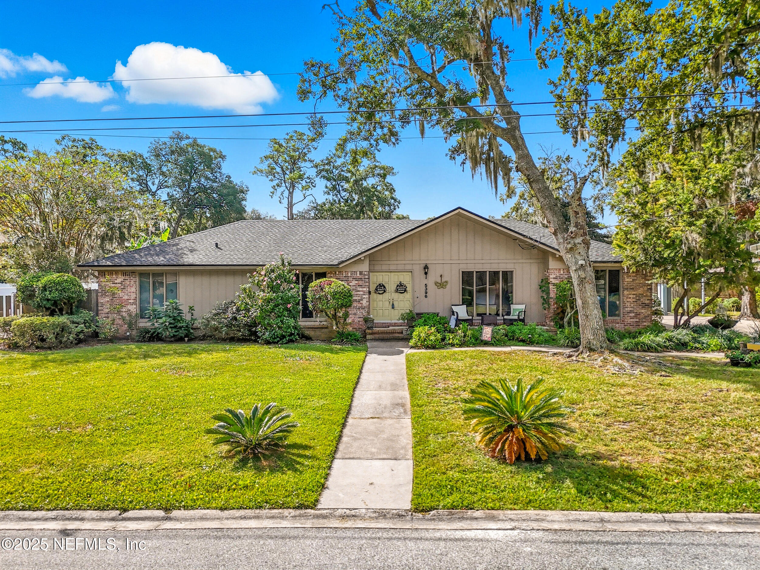 5396 Golf Course Drive Jacksonville, FL 32277 - Photo 2 of 62 a front view of house with yard and lake view