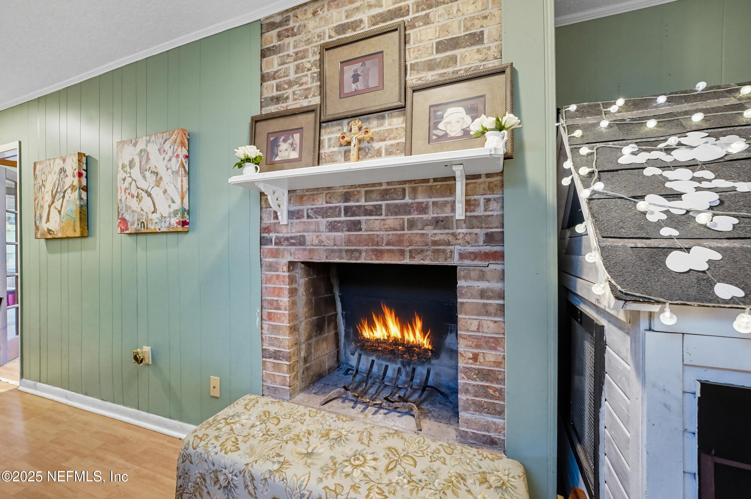 5396 Golf Course Drive Jacksonville, FL 32277 - Photo 26 of 62 a bedroom with a bed and a fireplace