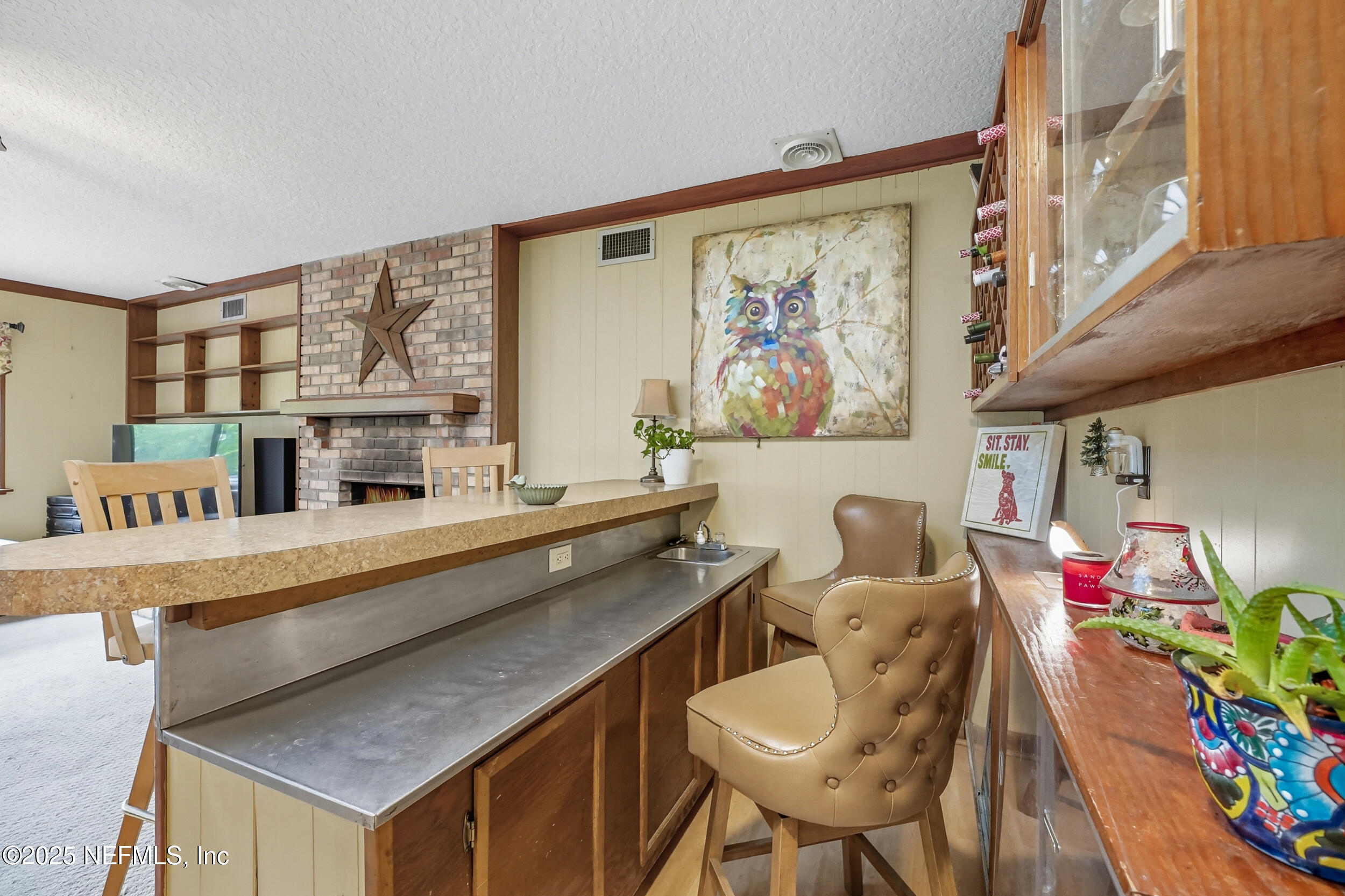 5396 Golf Course Drive Jacksonville, FL 32277 - Photo 27 of 62 a living room with furniture and a flat screen tv