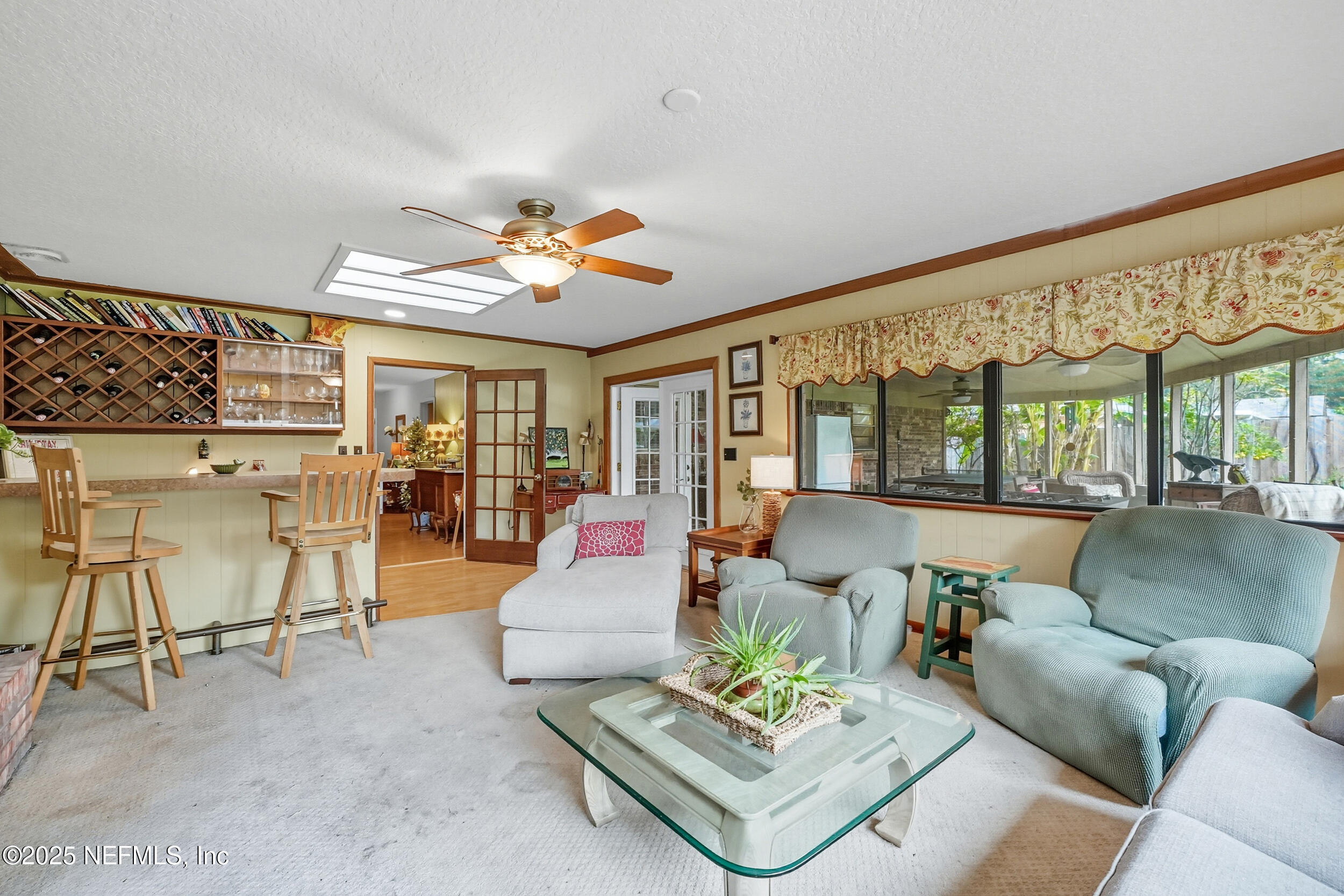 5396 Golf Course Drive Jacksonville, FL 32277 - Photo 29 of 62 a living room with furniture and a large window