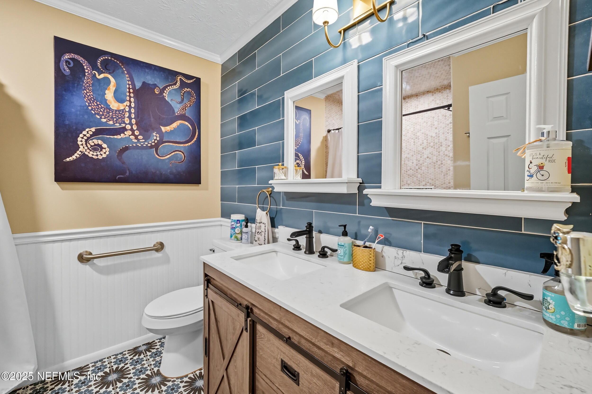 5396 Golf Course Drive Jacksonville, FL 32277 - Photo 3 of 62 a bathroom with a sink a vanity and a toilet