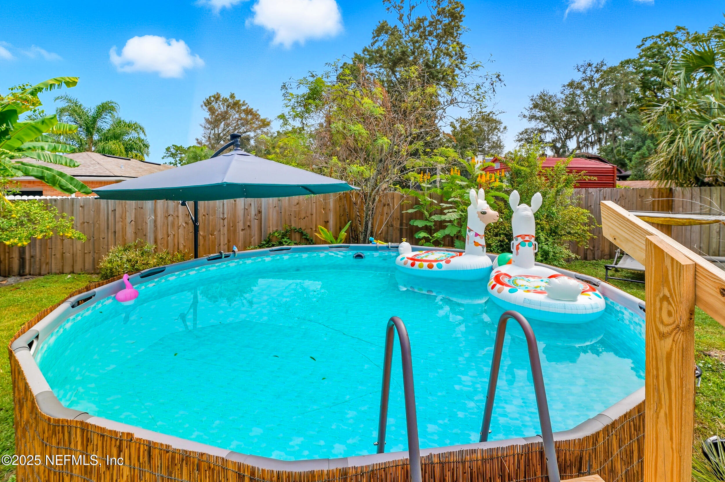 5396 Golf Course Drive Jacksonville, FL 32277 - Photo 40 of 62 a view of a backyard with plants and outdoor seating