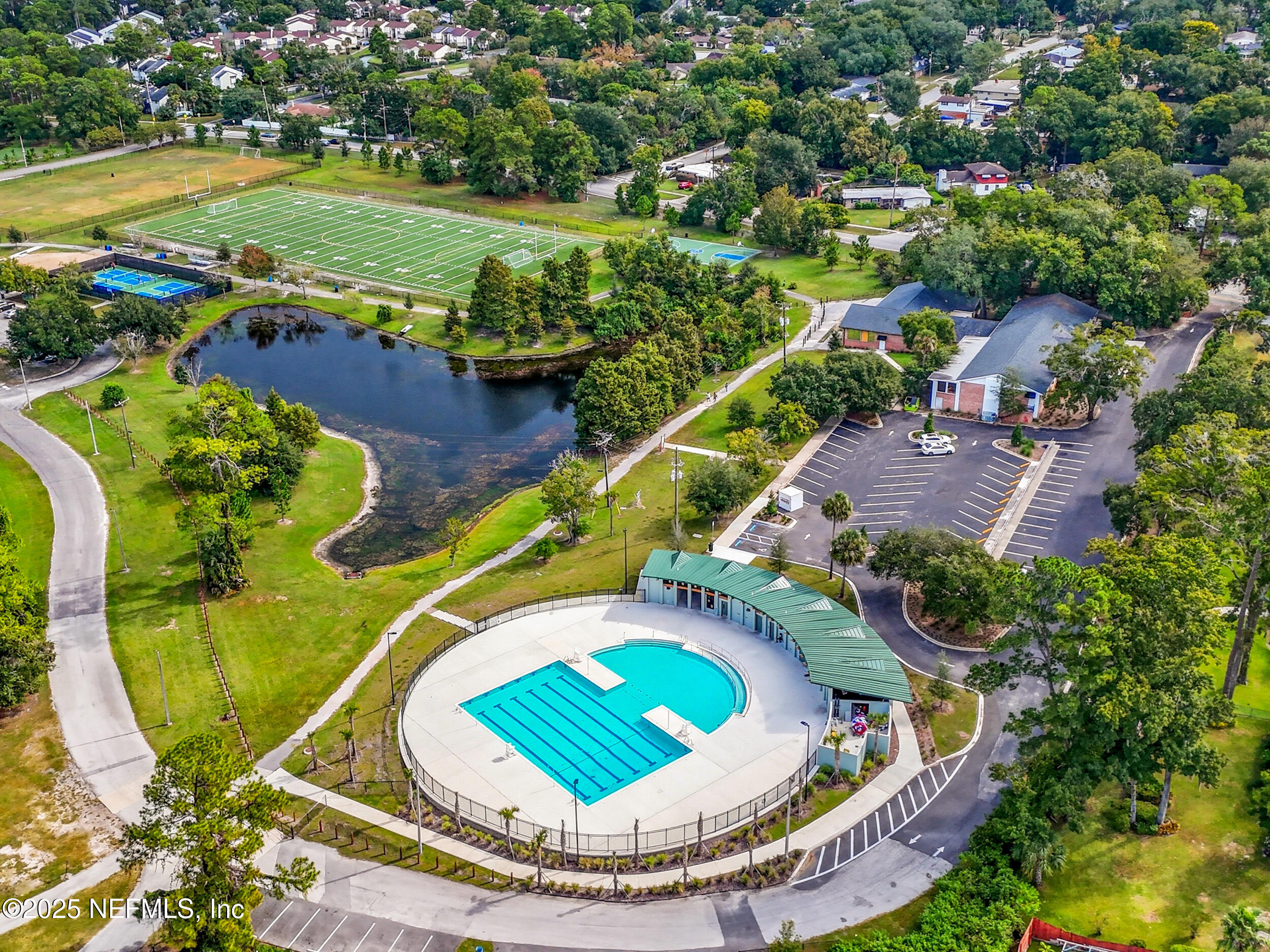 5396 Golf Course Drive Jacksonville, FL 32277 - Photo 44 of 62 an aerial view of a house with a swimming pool yard and outdoor seating