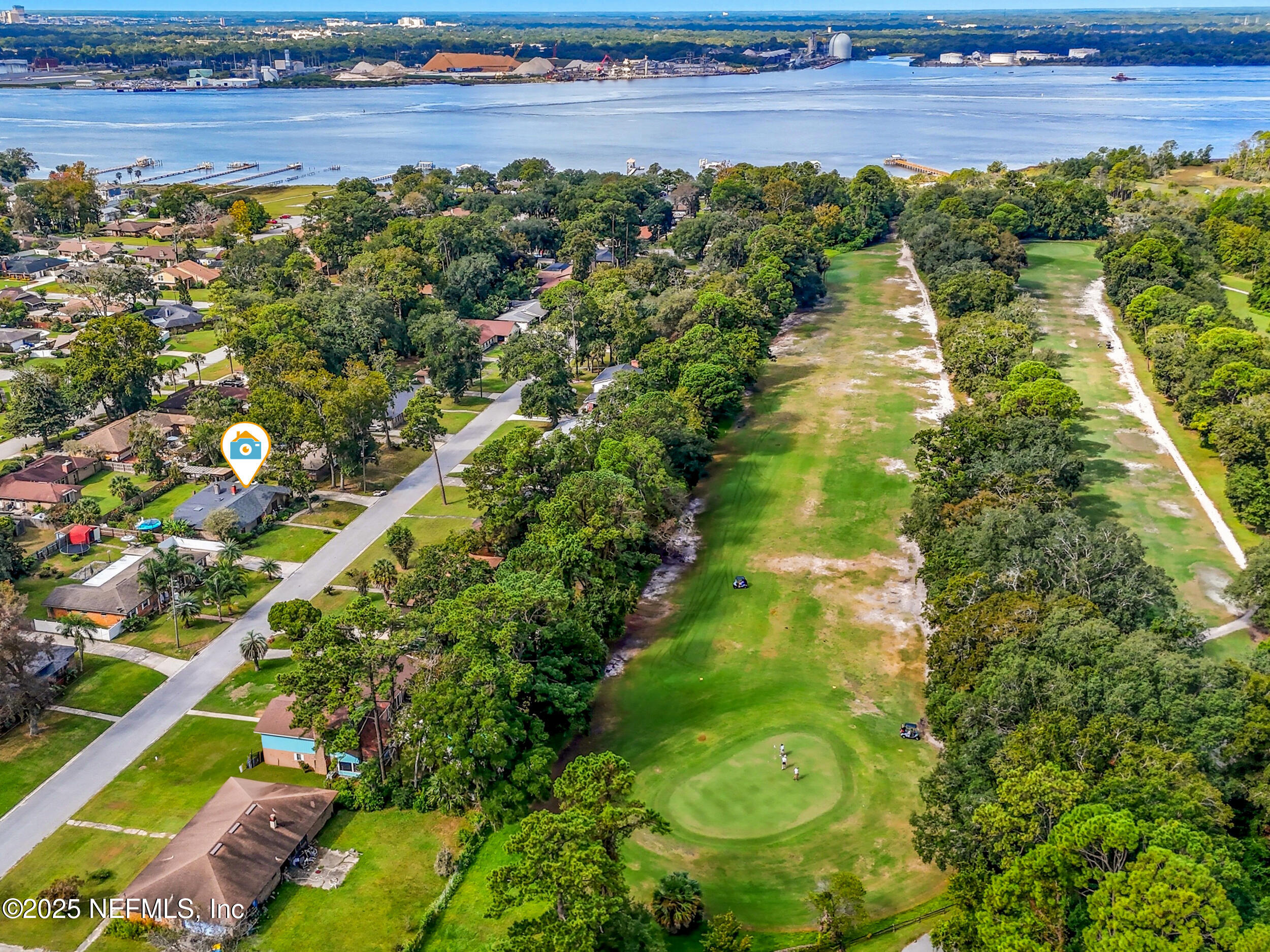5396 Golf Course Drive Jacksonville, FL 32277 - Photo 49 of 62 a view of a lake with a big yard