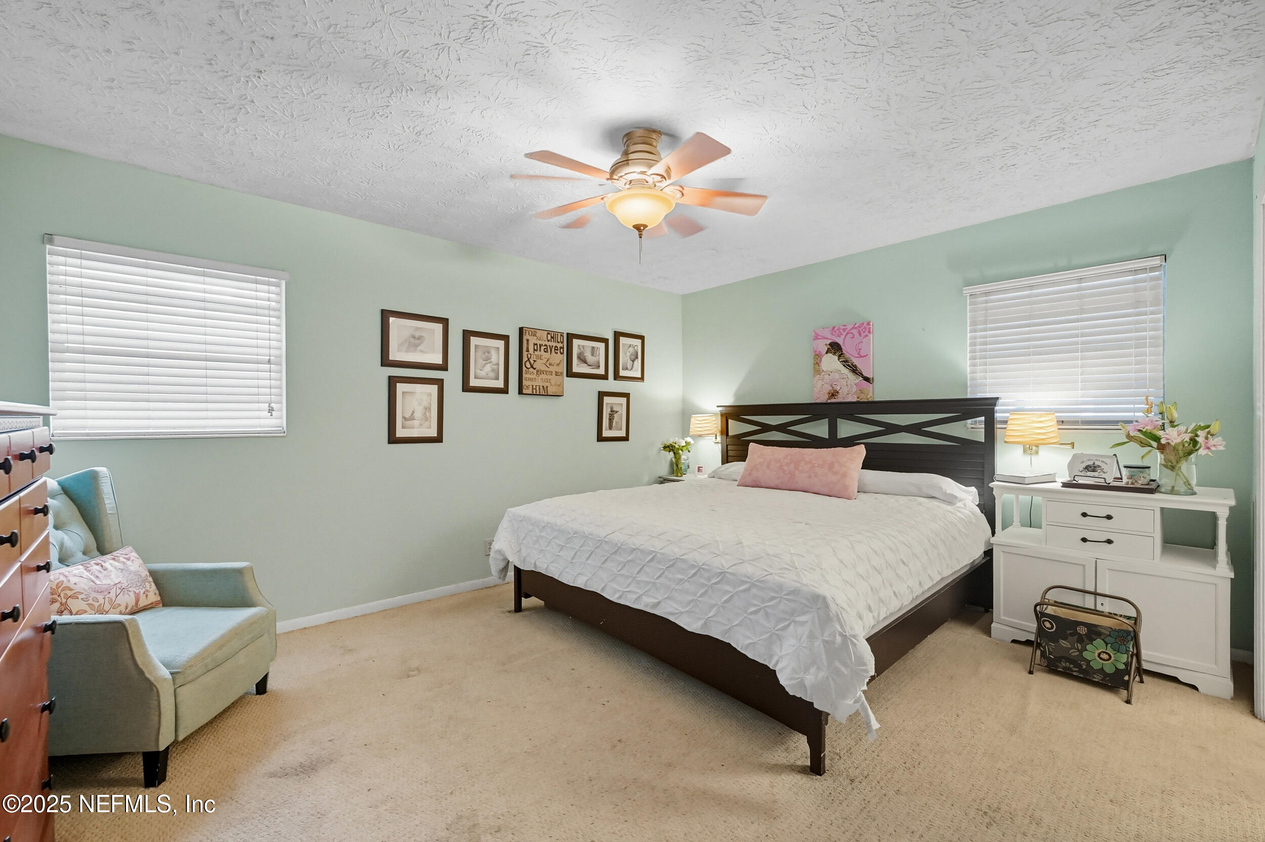 5396 Golf Course Drive Jacksonville, FL 32277 - Photo 5 of 62 a bedroom with a bed and furniture