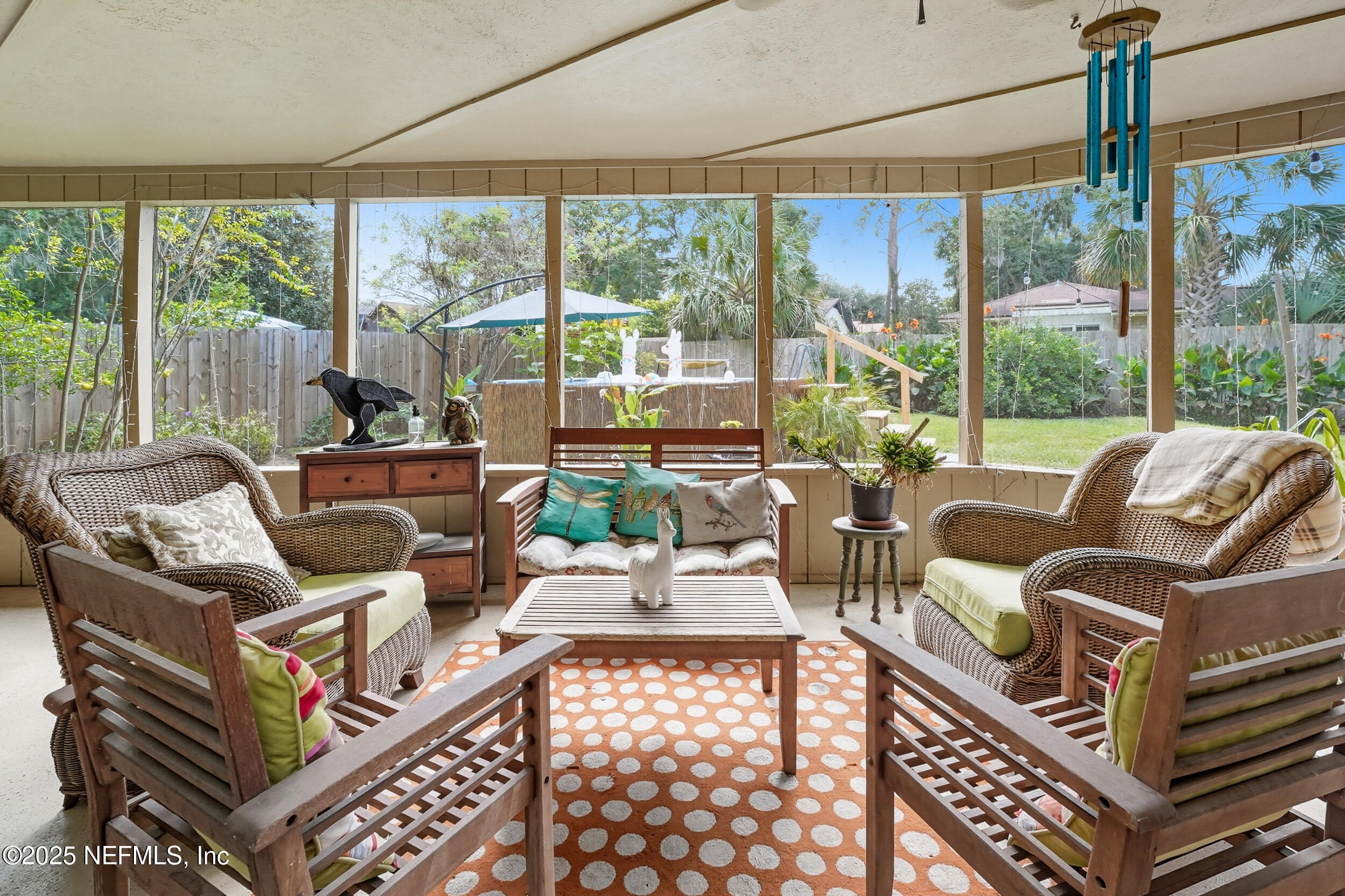 5396 Golf Course Drive Jacksonville, FL 32277 - Photo 8 of 62 a living room with furniture a large window and a table