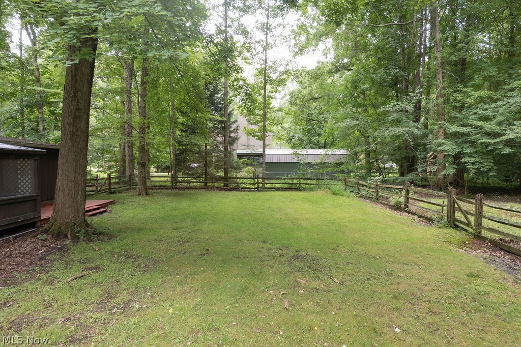 18620 Shaw Road Chagrin Falls, OH 44023 - Photo 41 of 44 Expansive grassy yard area defined by mature trees and natural wood fencing