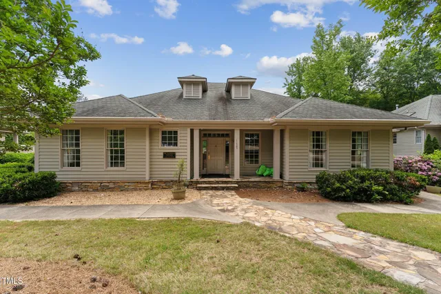 a front view of a house with garden