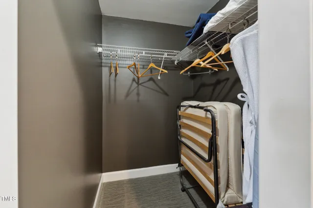 a living room with furniture a table and chairs