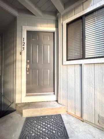 a view of a door and a window