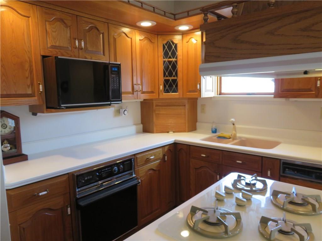 1860 Mercer Grove City Road Mercer, PA 16137 - Photo 7 of 25 Country kitchen with appliances dishwasher, oven gas cook top, microwave, & refrigerator.