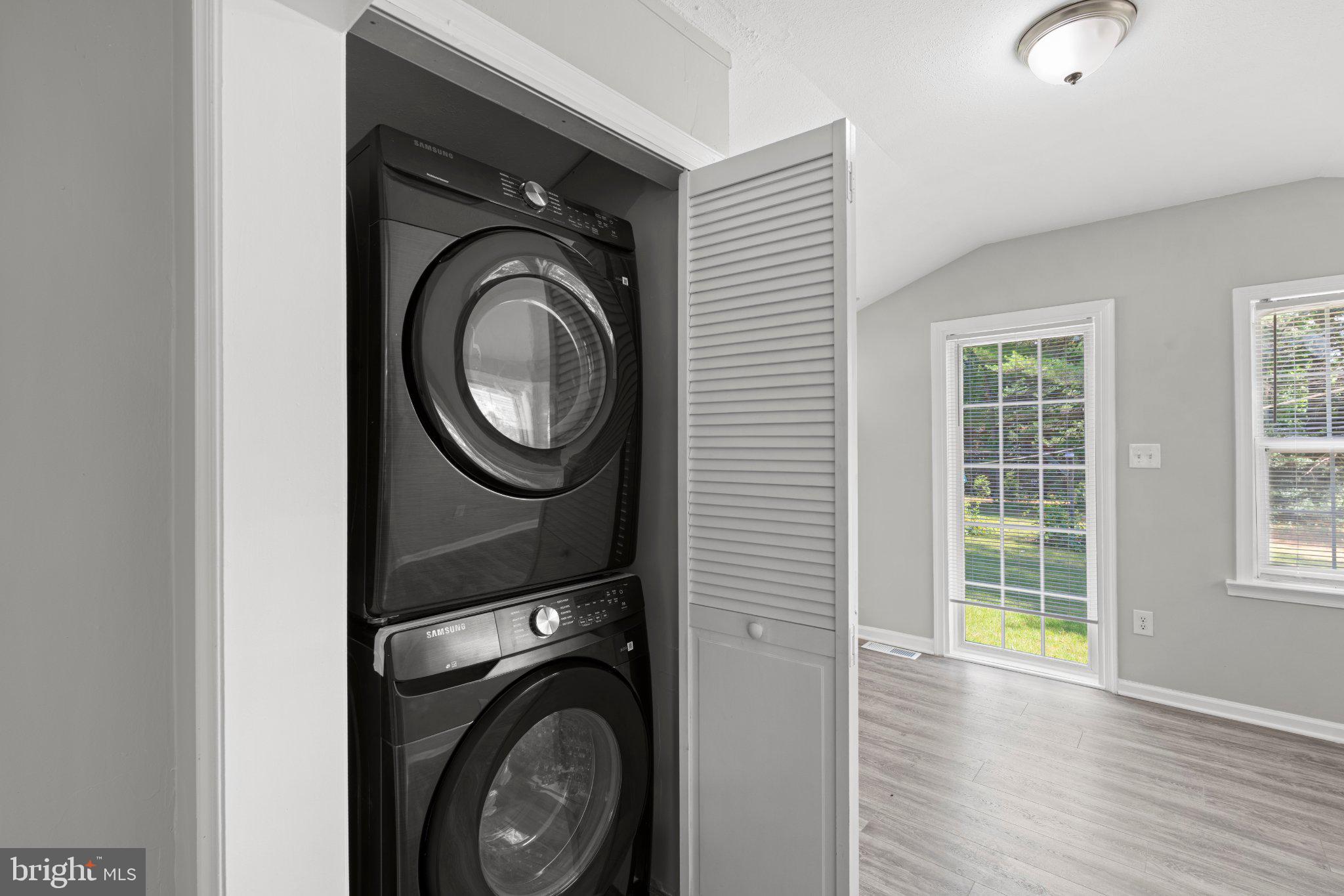 8405 Shirley Road Spotsylvania, VA 22551 - Photo 32 of 42 a view of a hallway with washer and dryer