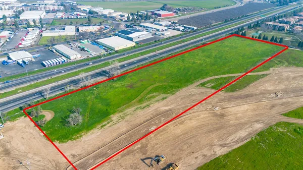 a view of a tennis ground with a small swimming pool