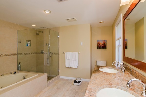 23 Solomon Pierce Road Lexington, MA 02420 - Photo 13 of 26 a bathroom with a tub sink mirror and vanity