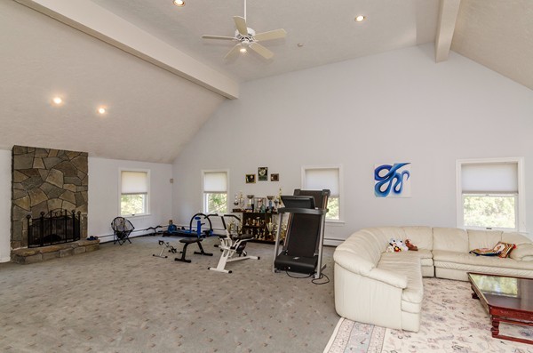 23 Solomon Pierce Road Lexington, MA 02420 - Photo 18 of 26 a living room with furniture and a flat screen tv