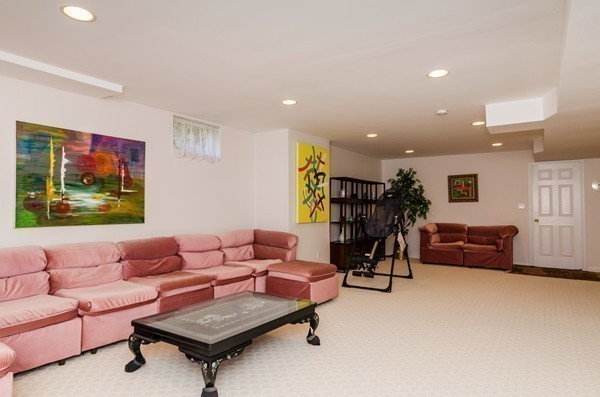 23 Solomon Pierce Road Lexington, MA 02420 - Photo 19 of 26 a living room with furniture and a table