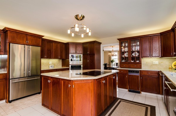 23 Solomon Pierce Road Lexington, MA 02420 - Photo 6 of 26 a kitchen with stainless steel appliances granite countertop a sink refrigerator and cabinets