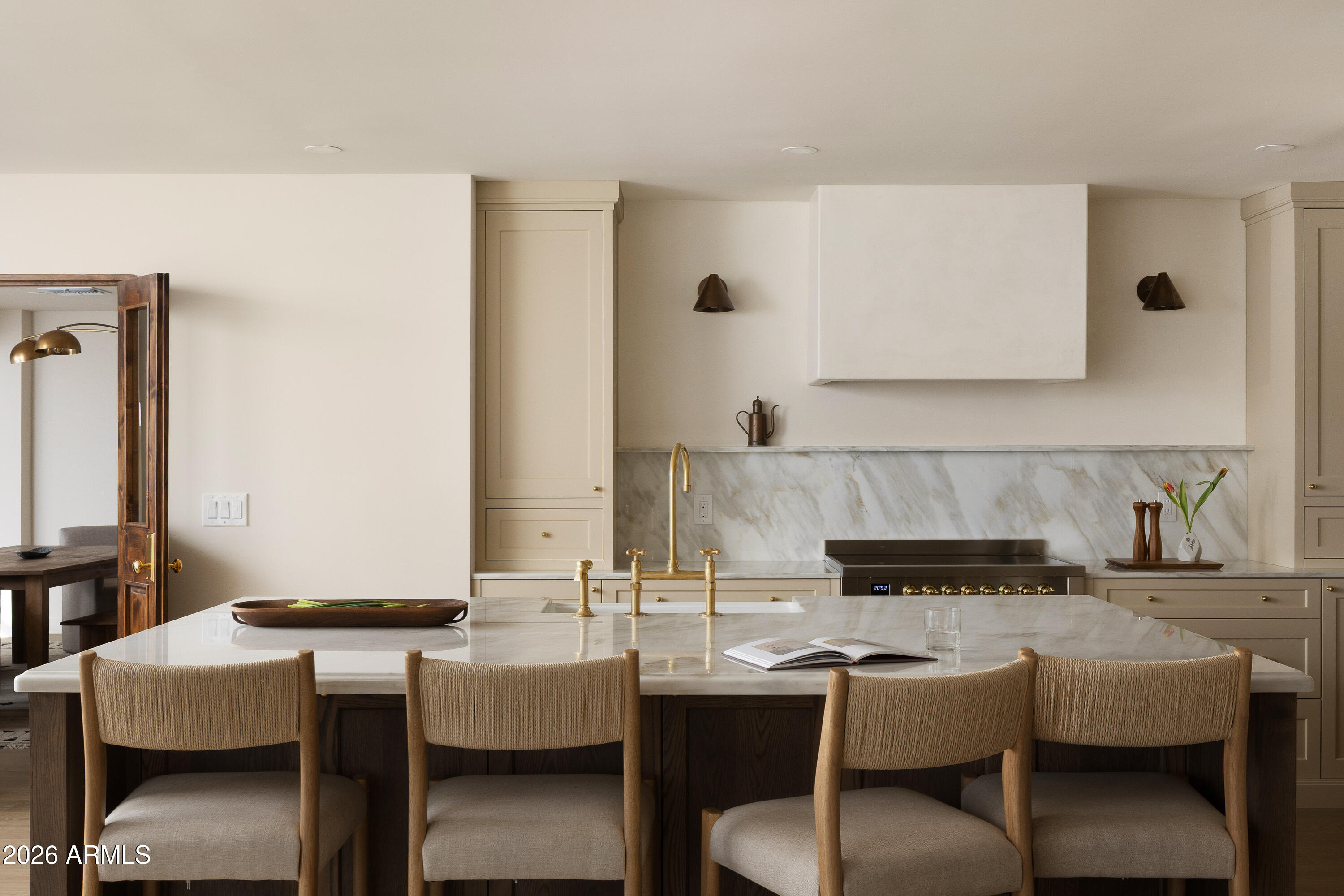 5501 East Camelback Road Phoenix, AZ 85018 - Photo 15 of 60 a kitchen with a table and chairs in it