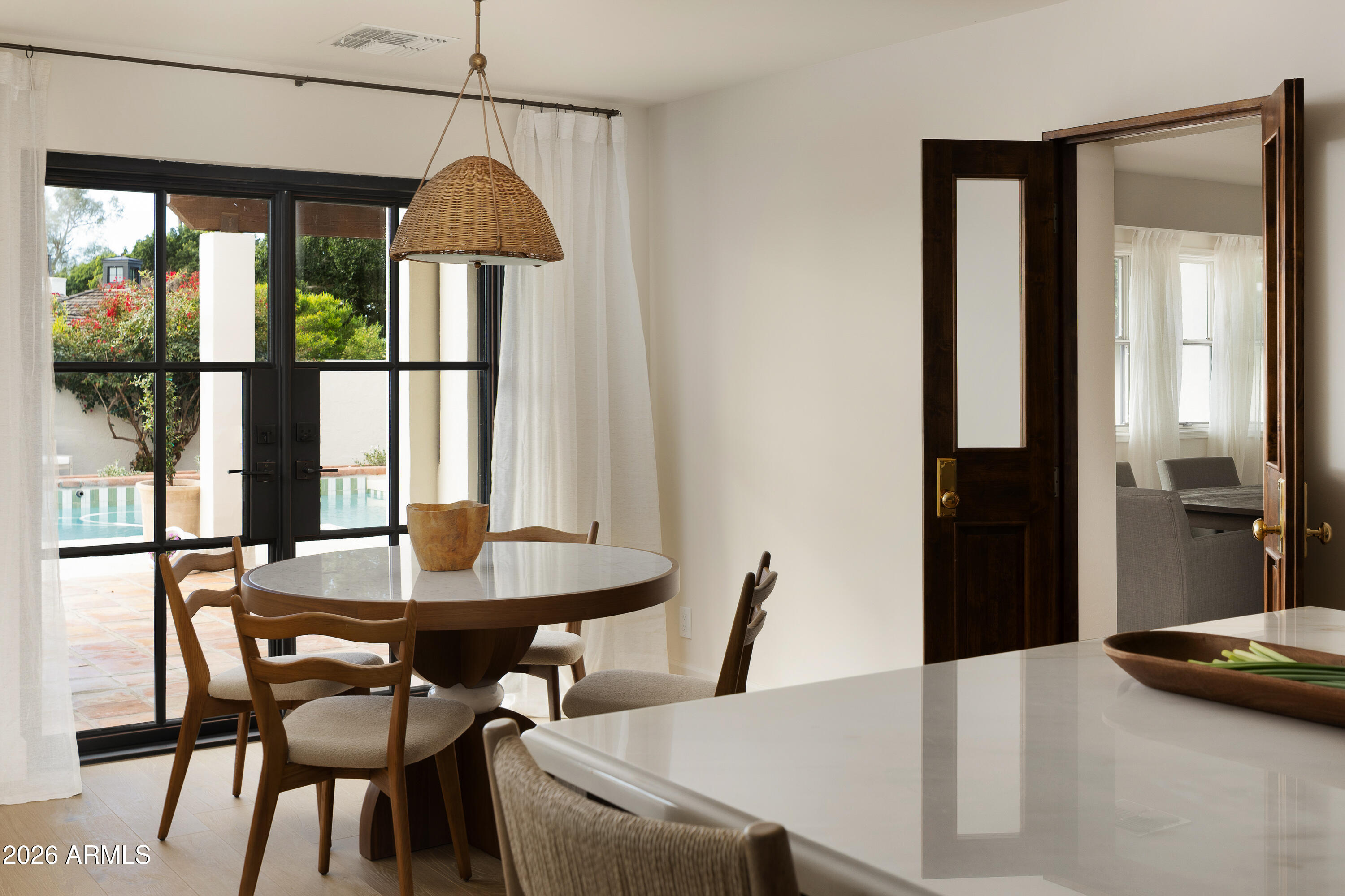5501 East Camelback Road Phoenix, AZ 85018 - Photo 23 of 60 a view of a dining room with furniture and window