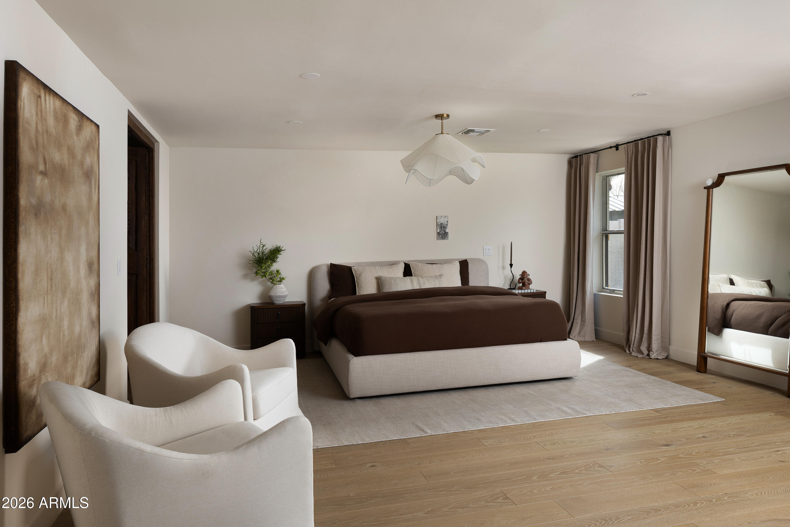 5501 East Camelback Road Phoenix, AZ 85018 - Photo 28 of 60 a living room with furniture and a lamp