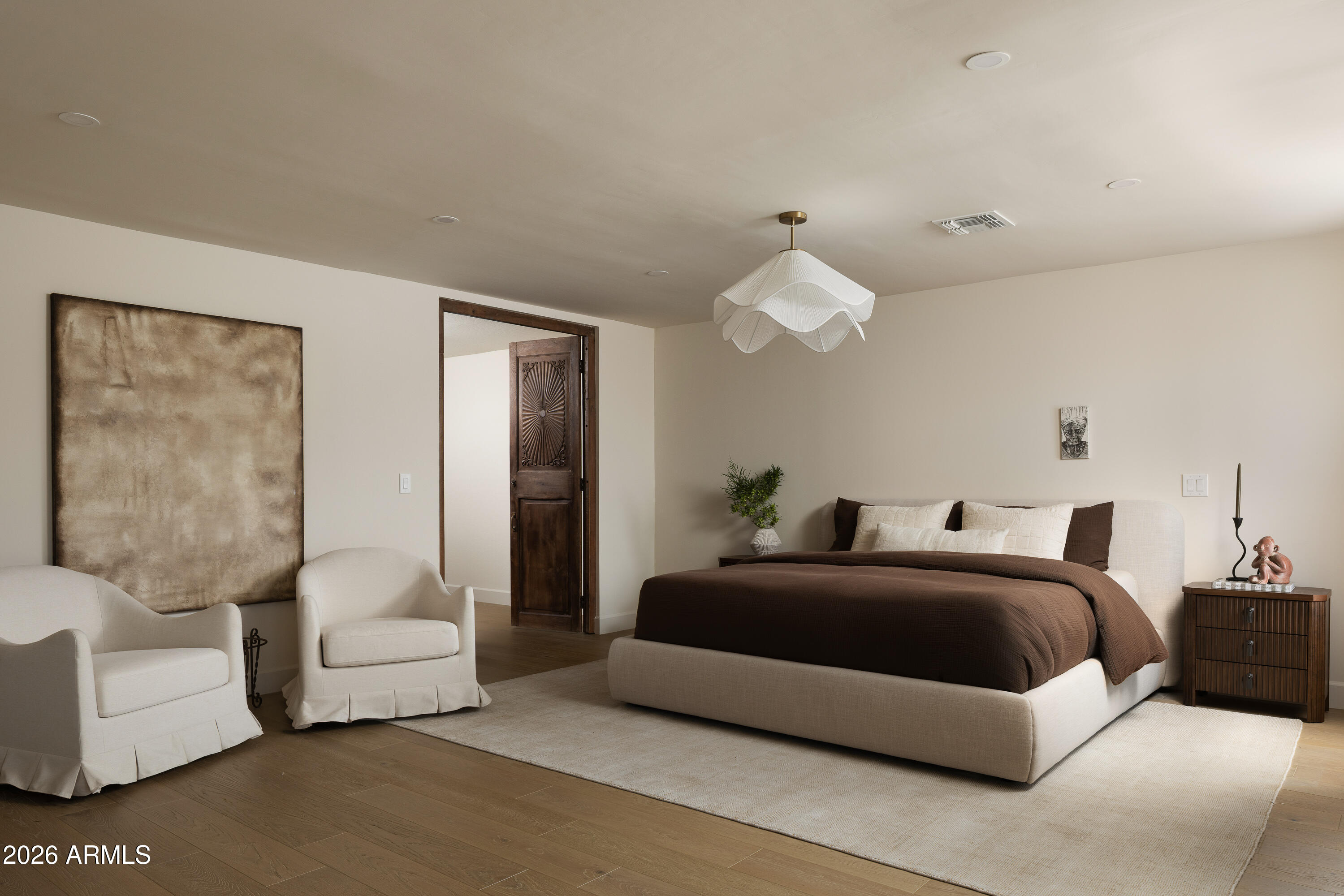 5501 East Camelback Road Phoenix, AZ 85018 - Photo 29 of 60 a bedroom with a bed couches and white walls