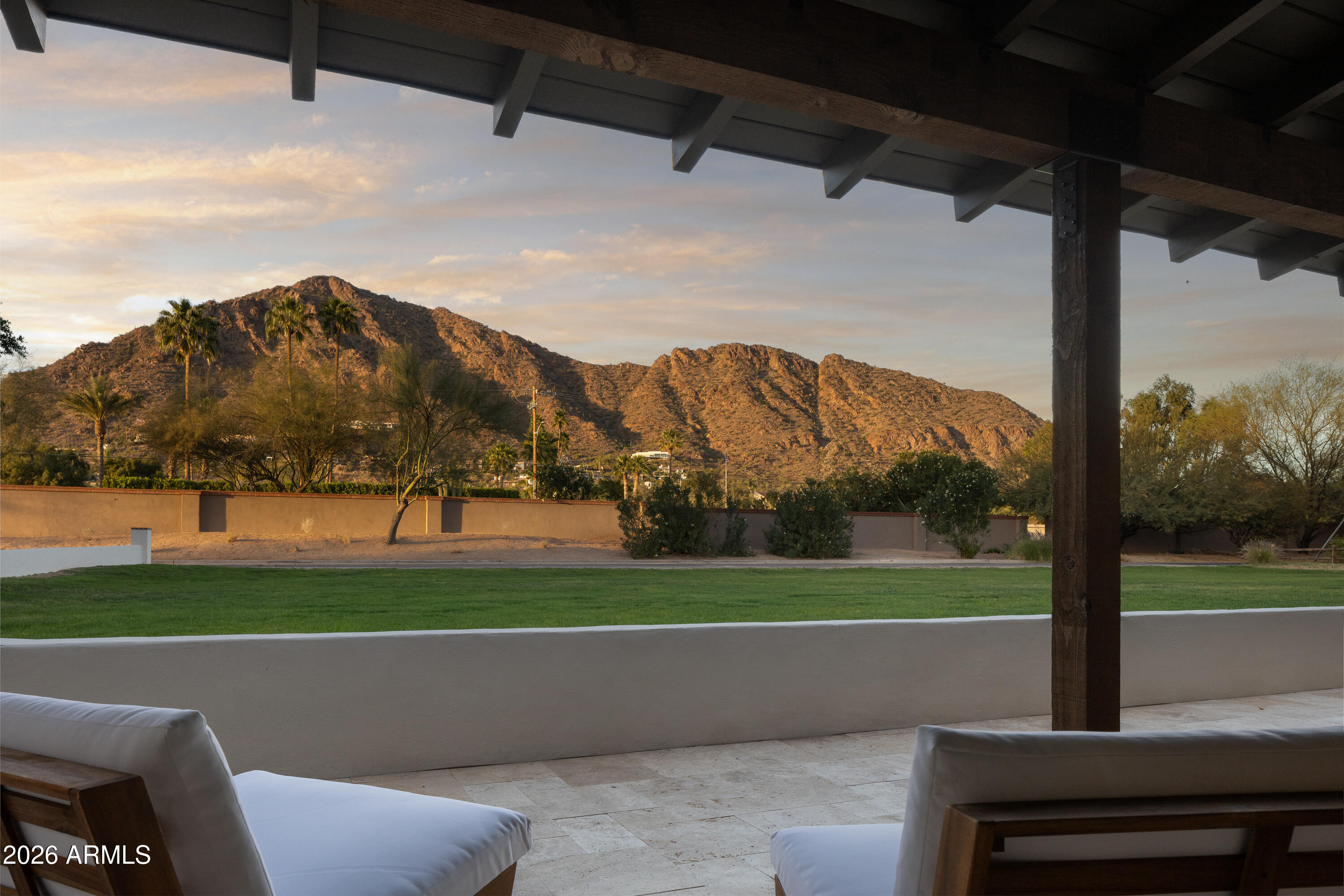 5501 East Camelback Road Phoenix, AZ 85018 - Photo 3 of 60 a view of a porch with a yard