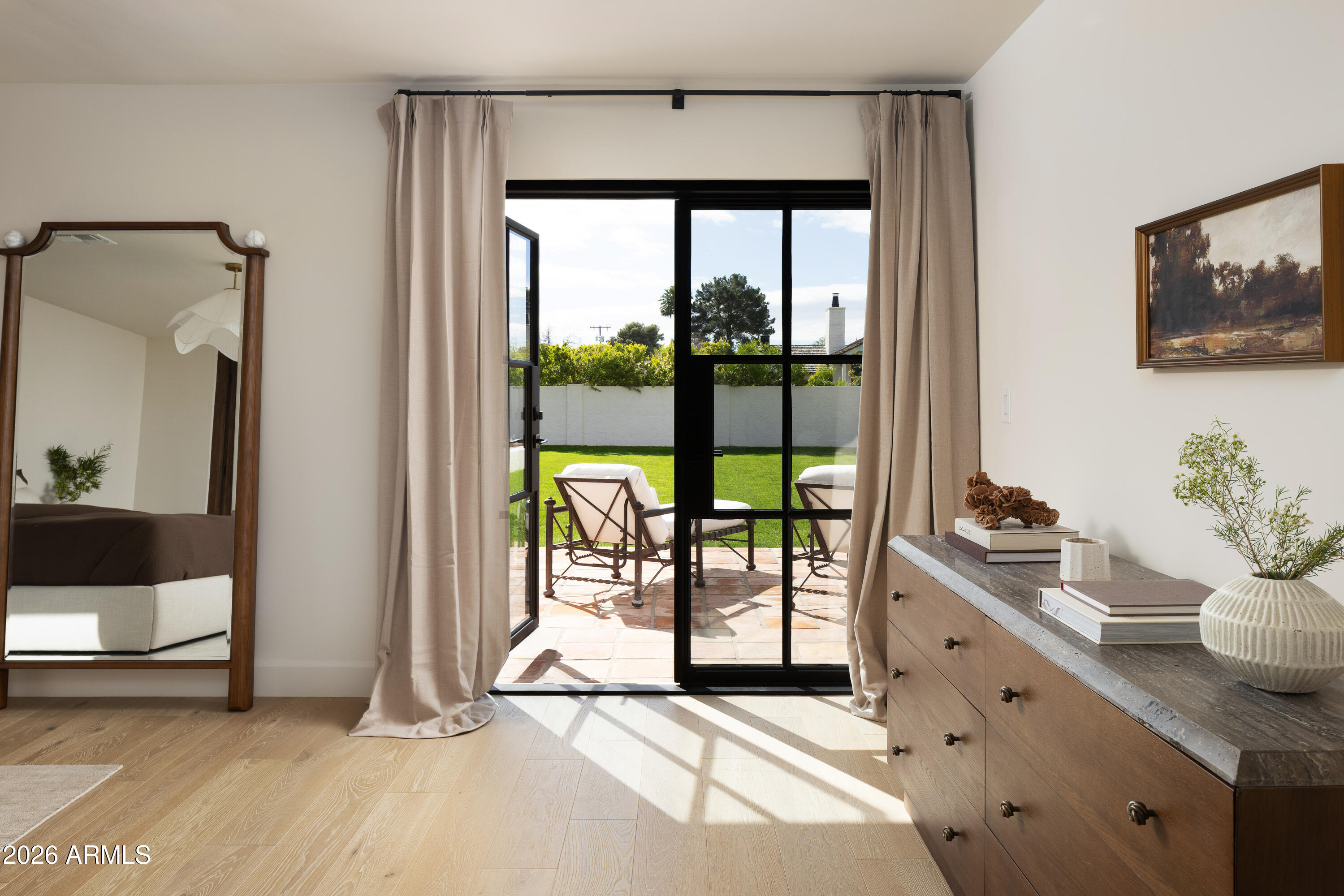 5501 East Camelback Road Phoenix, AZ 85018 - Photo 31 of 60 a spacious bedroom with a balcony a bed and a potted plant