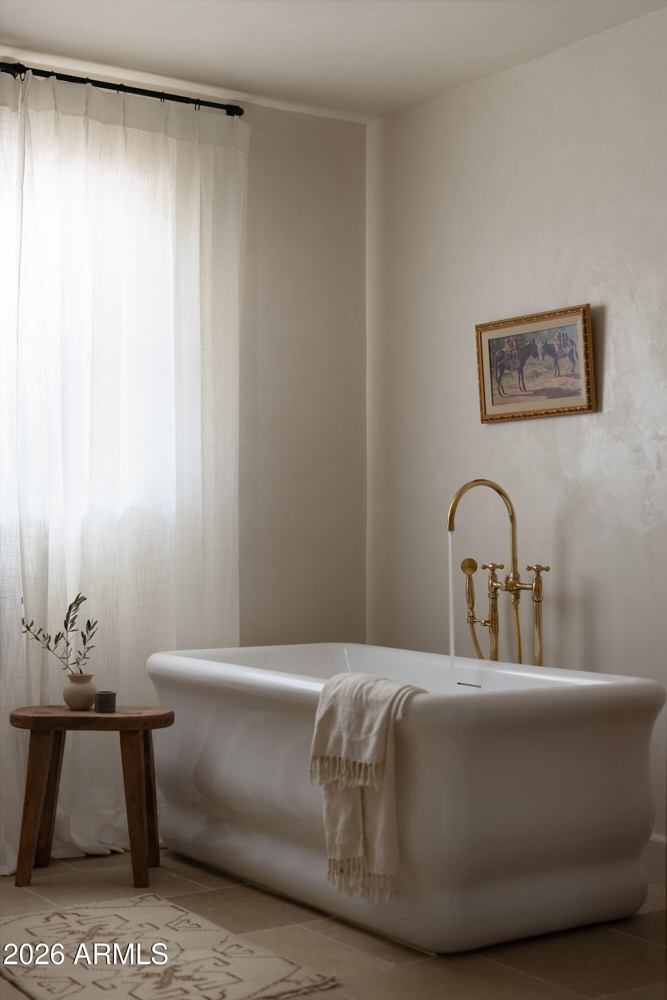 5501 East Camelback Road Phoenix, AZ 85018 - Photo 33 of 60 a bedroom with a bed and a table