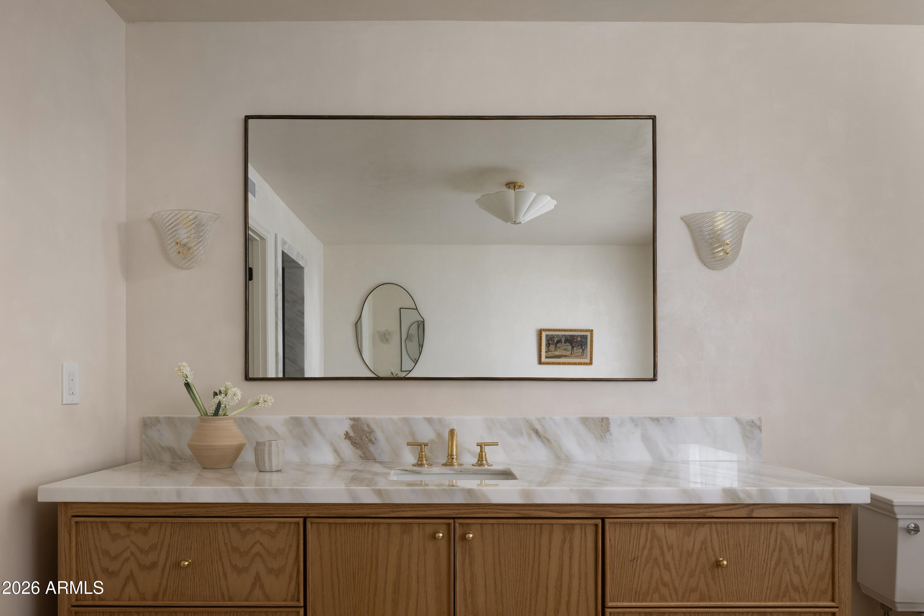 5501 East Camelback Road Phoenix, AZ 85018 - Photo 37 of 60 a bathroom with a granite countertop sink and a mirror