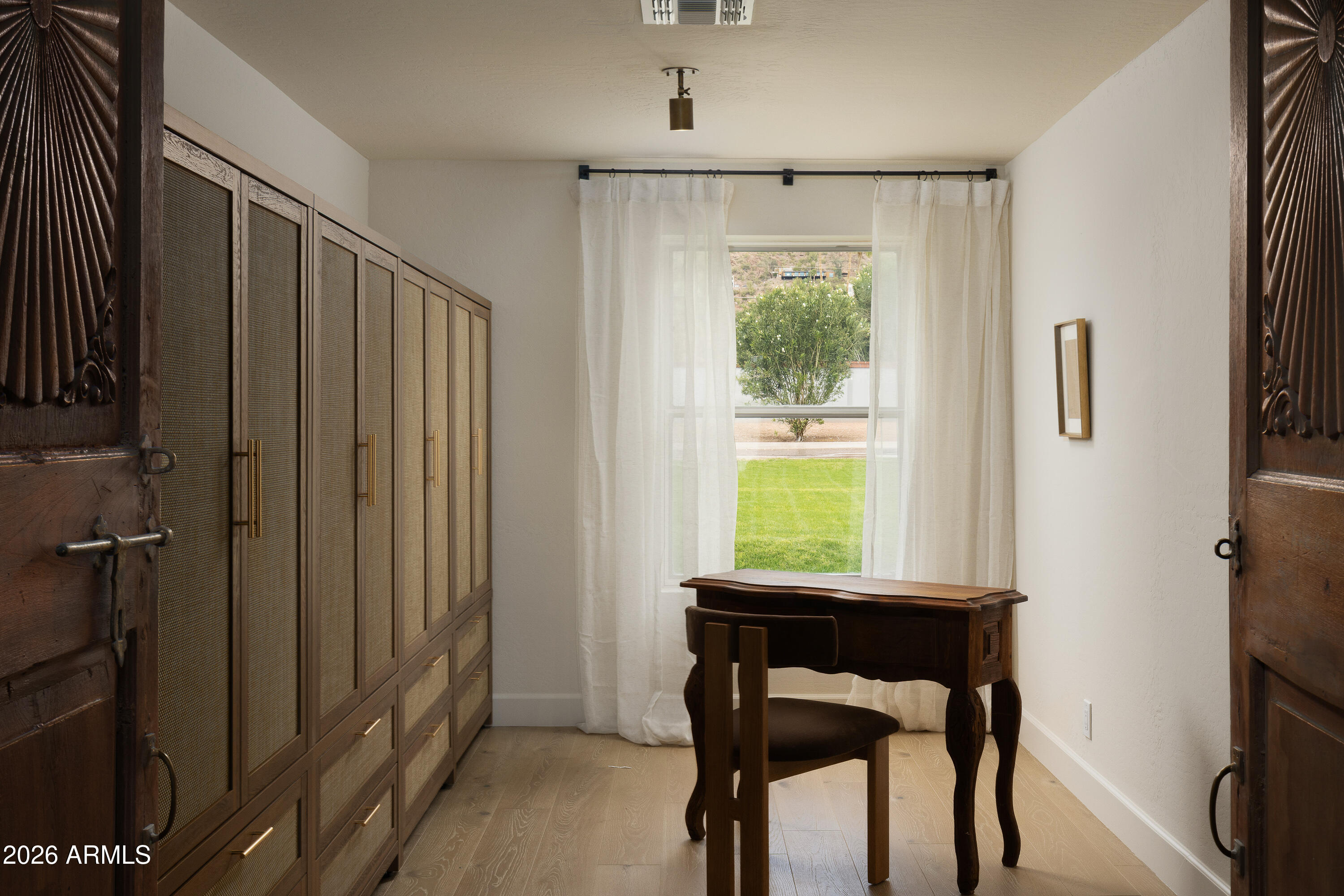 5501 East Camelback Road Phoenix, AZ 85018 - Photo 38 of 60 a view of a workspace with furniture and a window